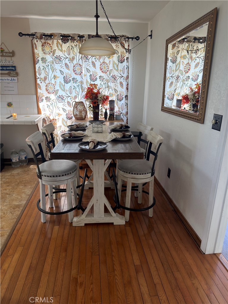 1610 North Grass Valley Road Lake Arrowhead, CA 92352 - Photo 23 of 28 a dining room with furniture and wooden floor