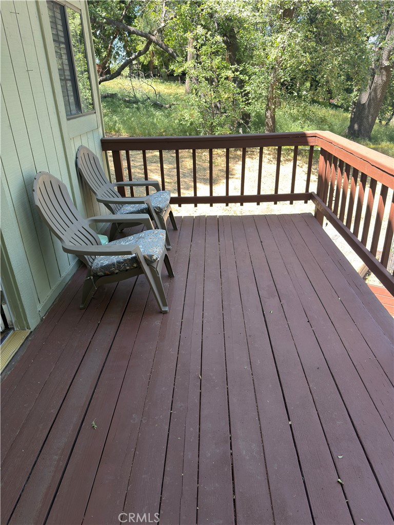 1610 North Grass Valley Road Lake Arrowhead, CA 92352 - Photo 27 of 28 a view of balcony with wooden floor and outdoor seating