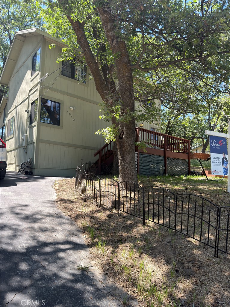 1610 North Grass Valley Road Lake Arrowhead, CA 92352 - Photo 5 of 28 a street view with wooden fence