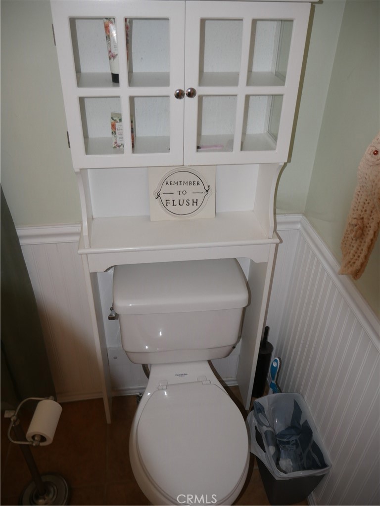 1610 North Grass Valley Road Lake Arrowhead, CA 92352 - Photo 8 of 28 a bathroom with a toilet and a sink