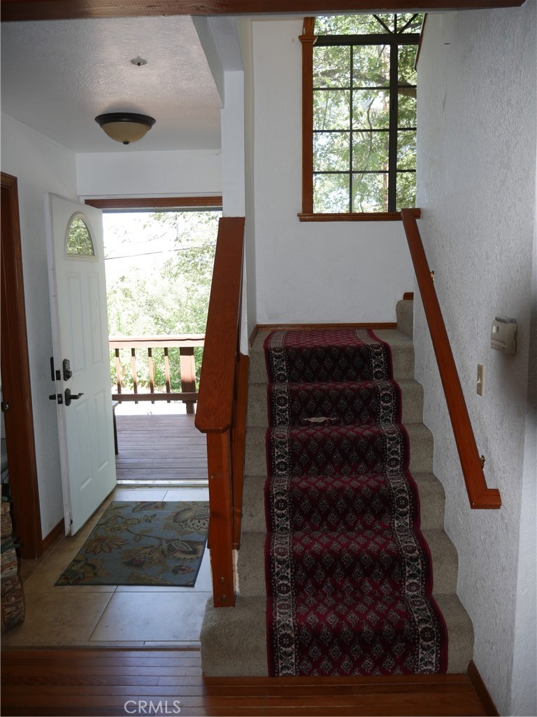 1610 North Grass Valley Road Lake Arrowhead, CA 92352 - Photo 9 of 28 a view of entryway and hall with wooden floor