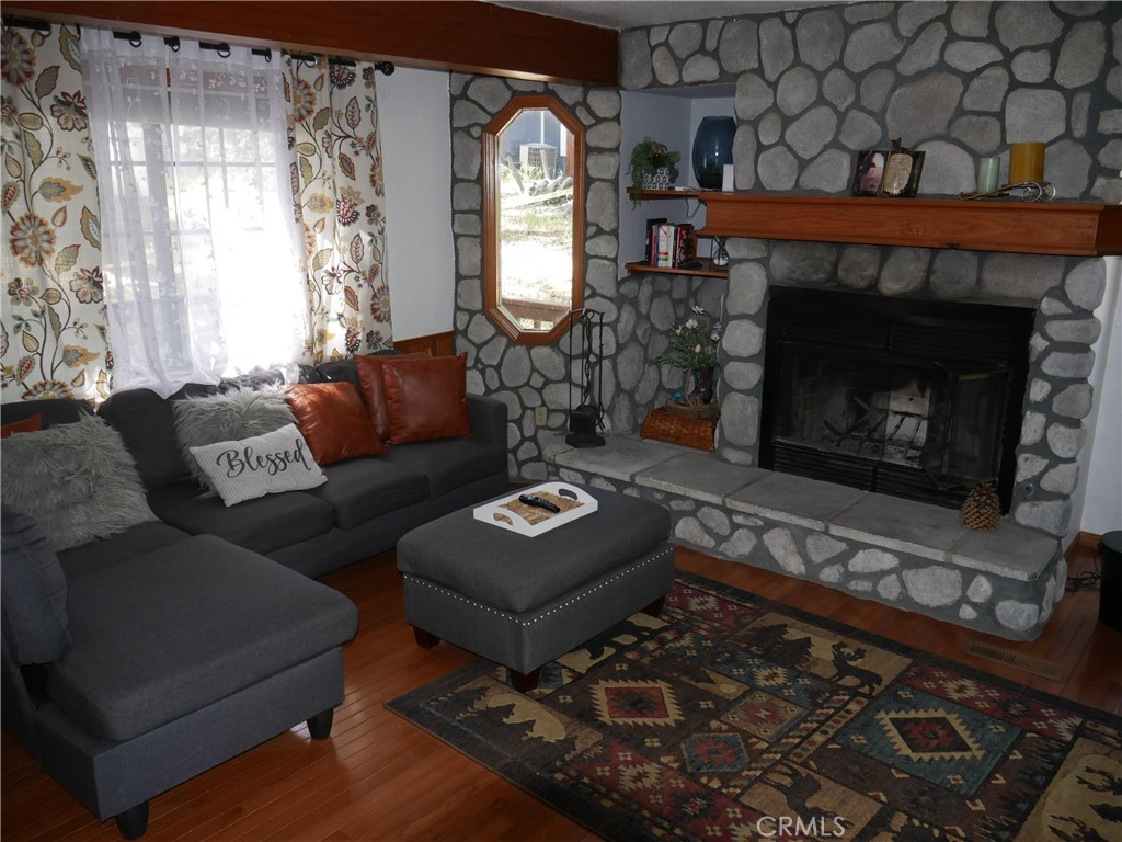 1610 North Grass Valley Road Lake Arrowhead, CA 92352 - Photo 10 of 28 a living room with furniture and a fireplace