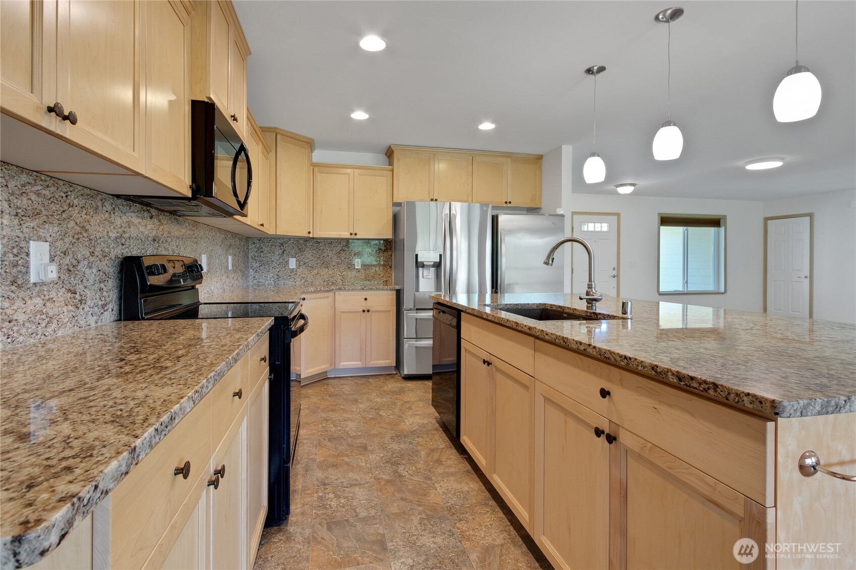 1450 Southeast Spruce Road Port Orchard, WA 98367 - Photo 8 of 39 a kitchen with stainless steel appliances granite countertop a sink and cabinets