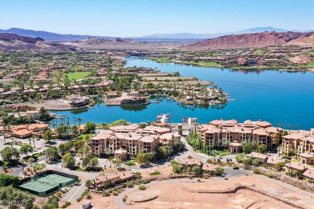 31 Via Mantova, Unit 2 Henderson, NV 89011 - Photo 23 of 30 Aerial perspective of suburban area featuring a water and mountain view