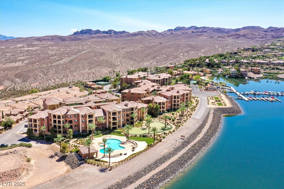 31 Via Mantova, Unit 2 Henderson, NV 89011 - Photo 26 of 30 Aerial view of a pool area and a water and mountain view