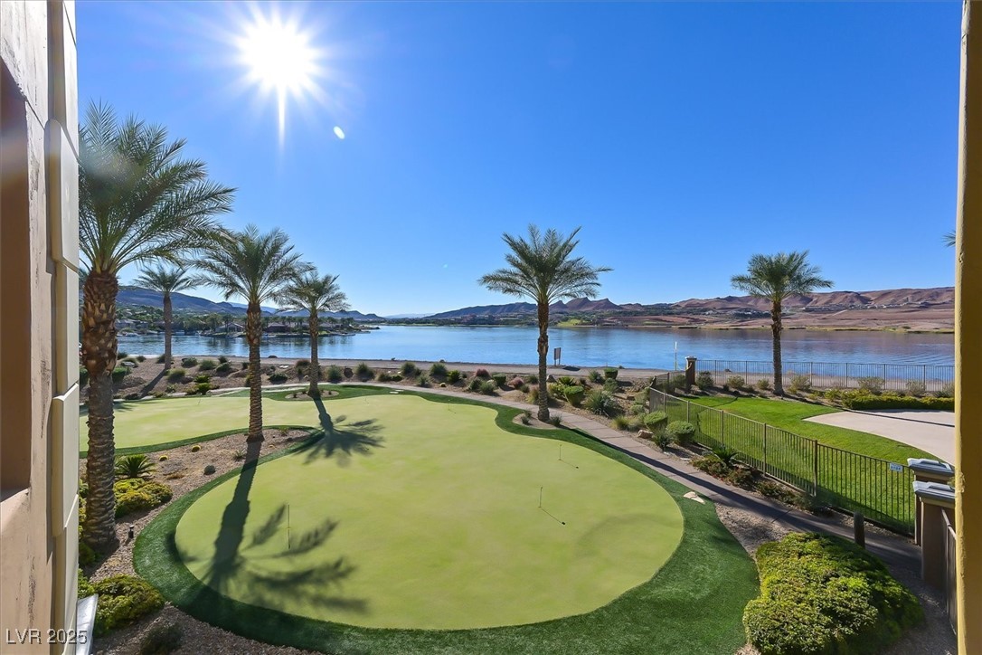 31 Via Mantova, Unit 2 Henderson, NV 89011 - Photo 29 of 30 View of property's community featuring a water and mountain view and a putting green