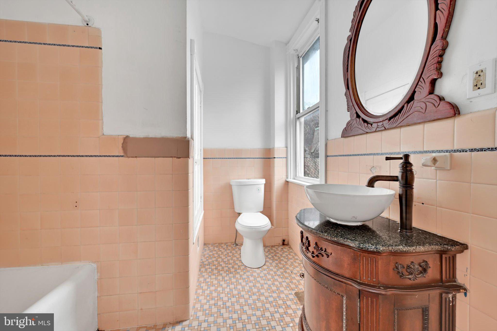 1330 Perkiomen Avenue Reading, PA 19602 - Photo 12 of 12 a bathroom with a toilet and a sink