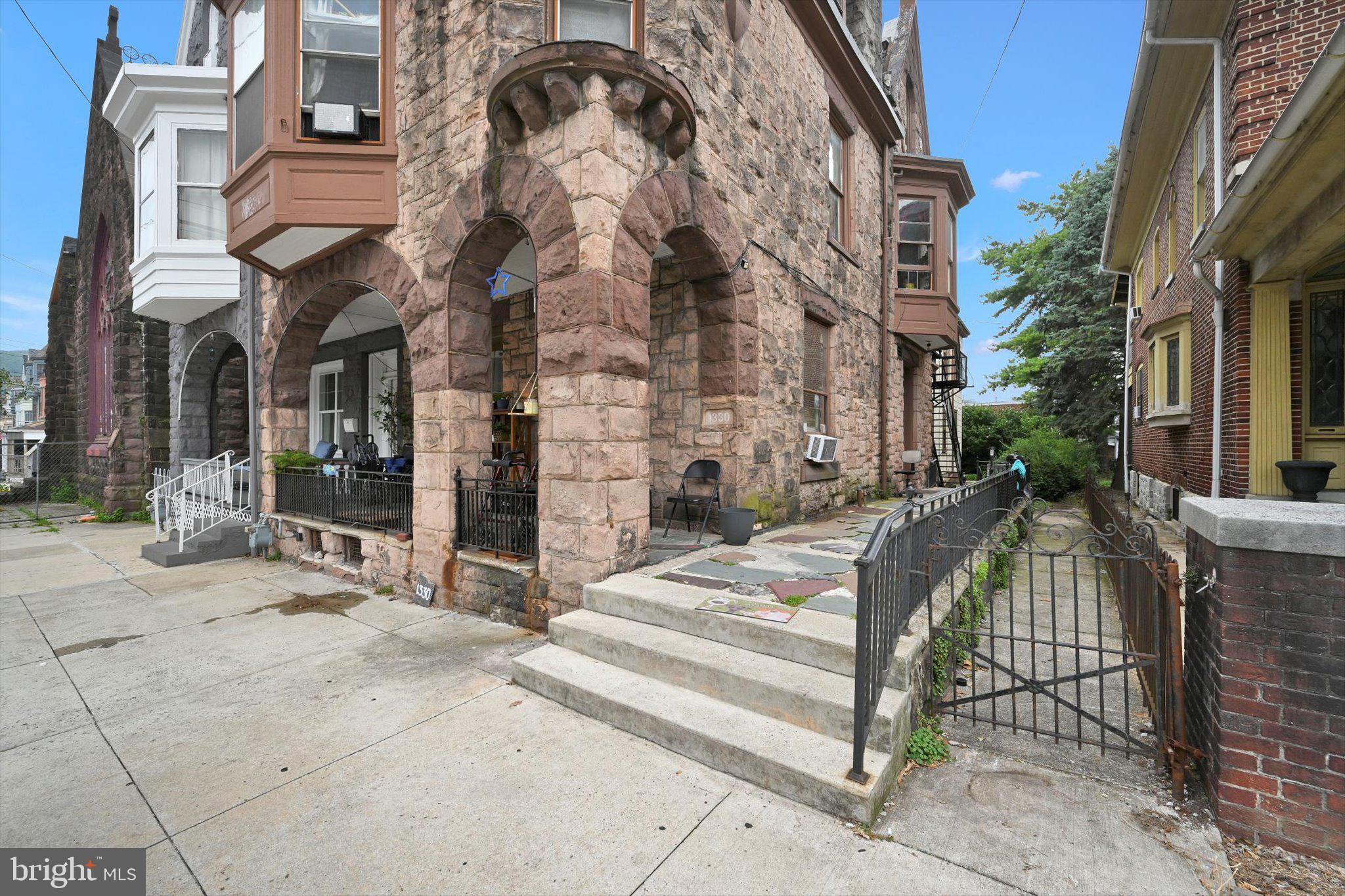 1330 Perkiomen Avenue Reading, PA 19602 - Photo 2 of 12 a view of a building with a bench in front of building