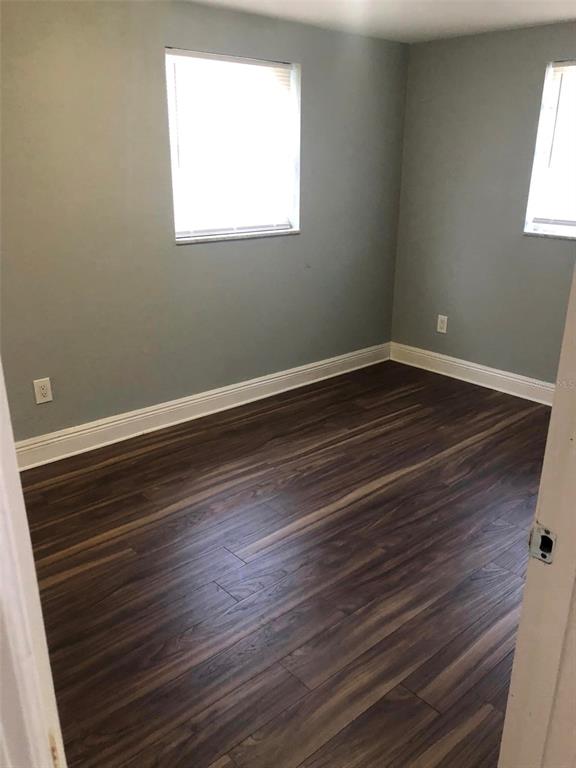 106 Karde Lane Brandon, FL 33510 - Photo 6 of 10 a view of a room with wooden floor and windows