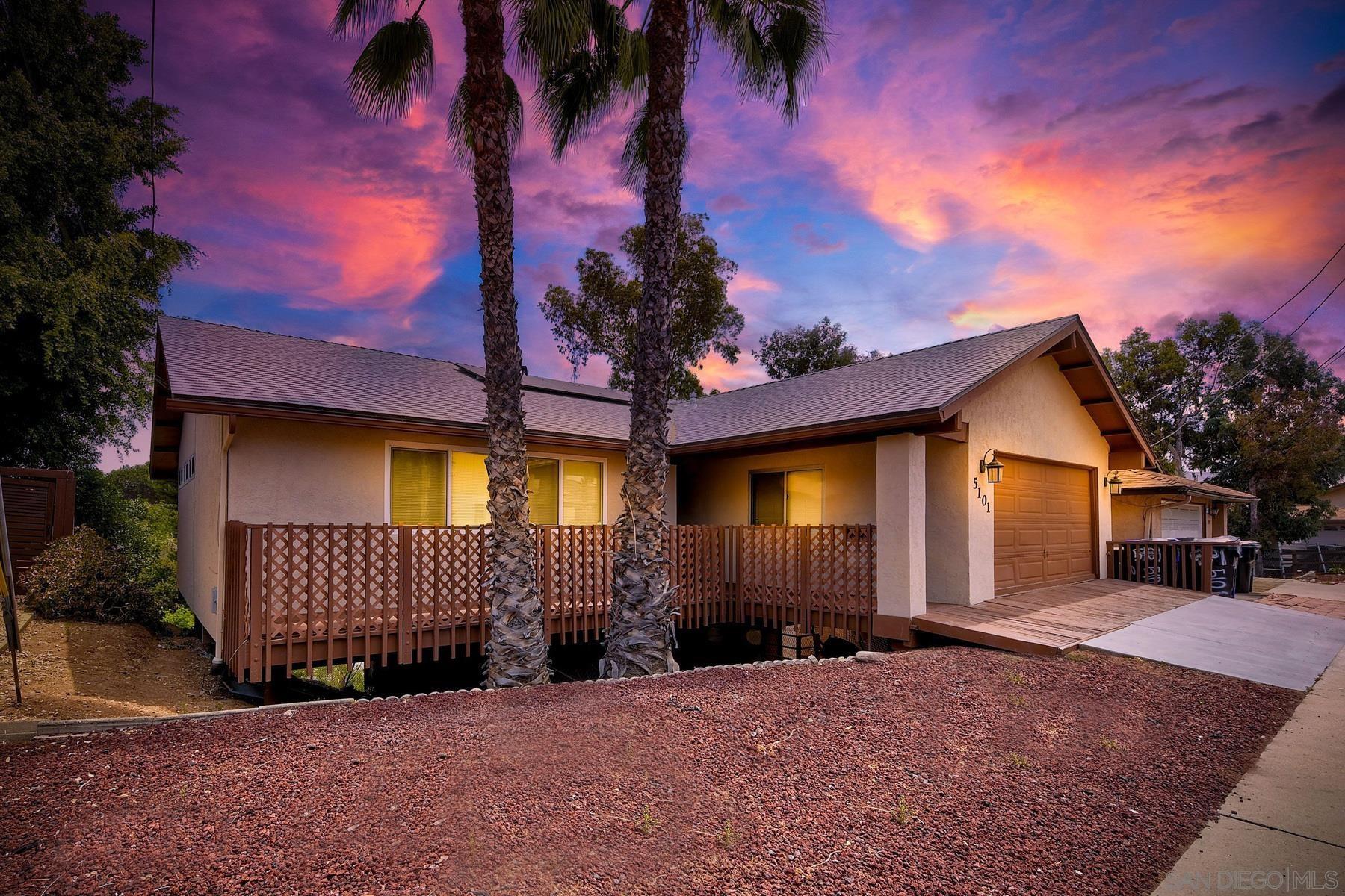 5101 Alumni Place San Diego, CA 92115 - Photo 1 of 38 a front view of a house with a yard