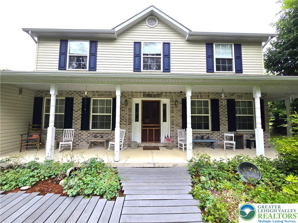 477 Quiet Valley Road Mount Bethel, PA 18343 - Photo 3 of 53 A classic facade welcomes with a generous porch, ideal for relaxation and curb appeal.