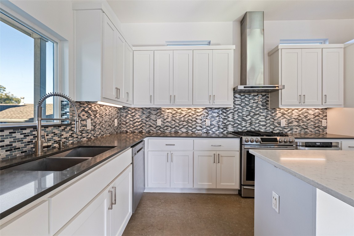 2201 Pennsylvania Avenue, Unit B Austin, TX 78702 - Photo 5 of 14 a kitchen with granite countertop a sink stove and cabinets