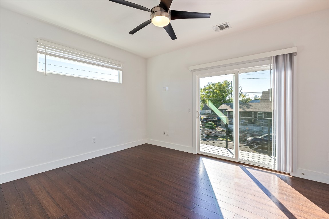 2201 Pennsylvania Avenue, Unit B Austin, TX 78702 - Photo 8 of 14 a view of an empty room with wooden floor and a window