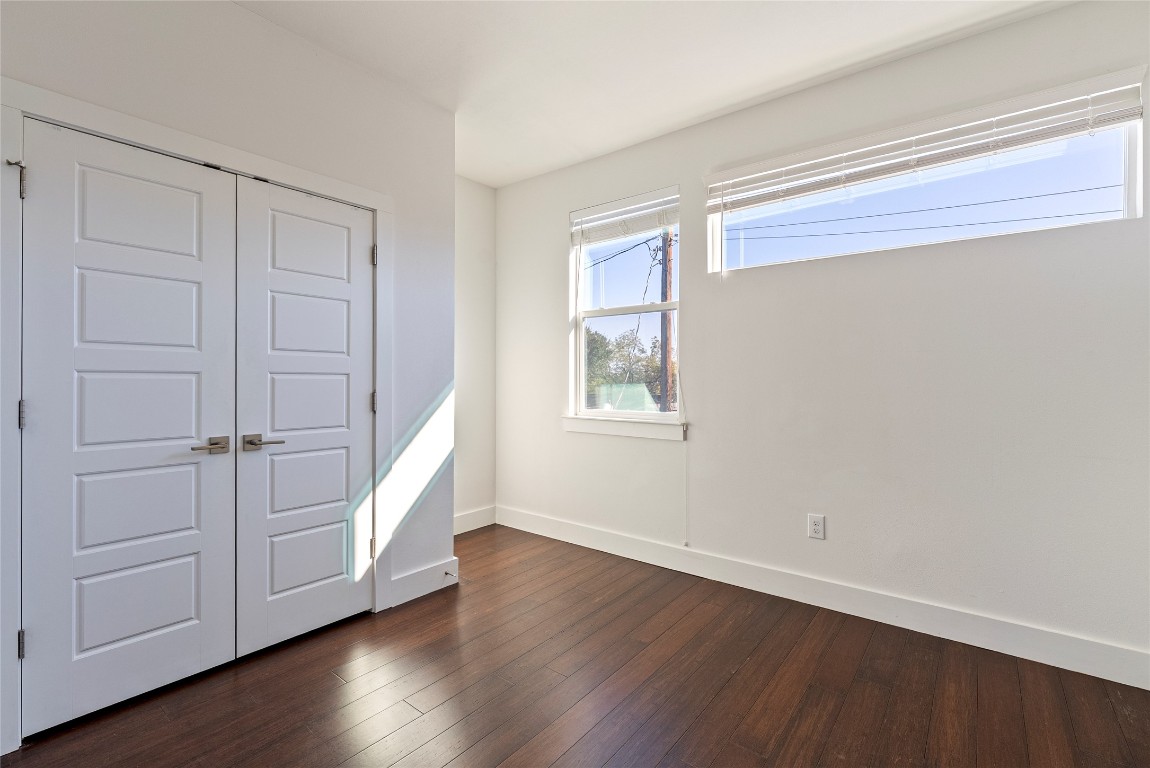 2201 Pennsylvania Avenue, Unit B Austin, TX 78702 - Photo 10 of 14 a view of an empty room with wooden floor and a window