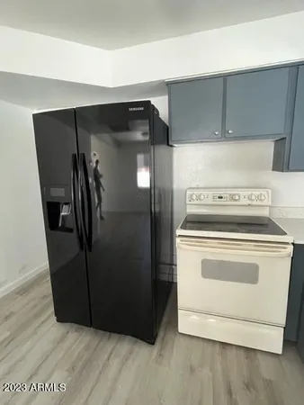 a kitchen with a stove and a refrigerator