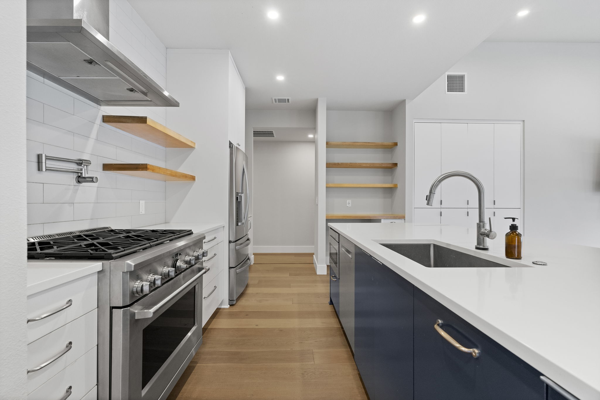 5604 Bull Creek Road Austin, TX 78756 - Photo 12 of 39 Amazing gas range with pot filler, perfect for home chefs!