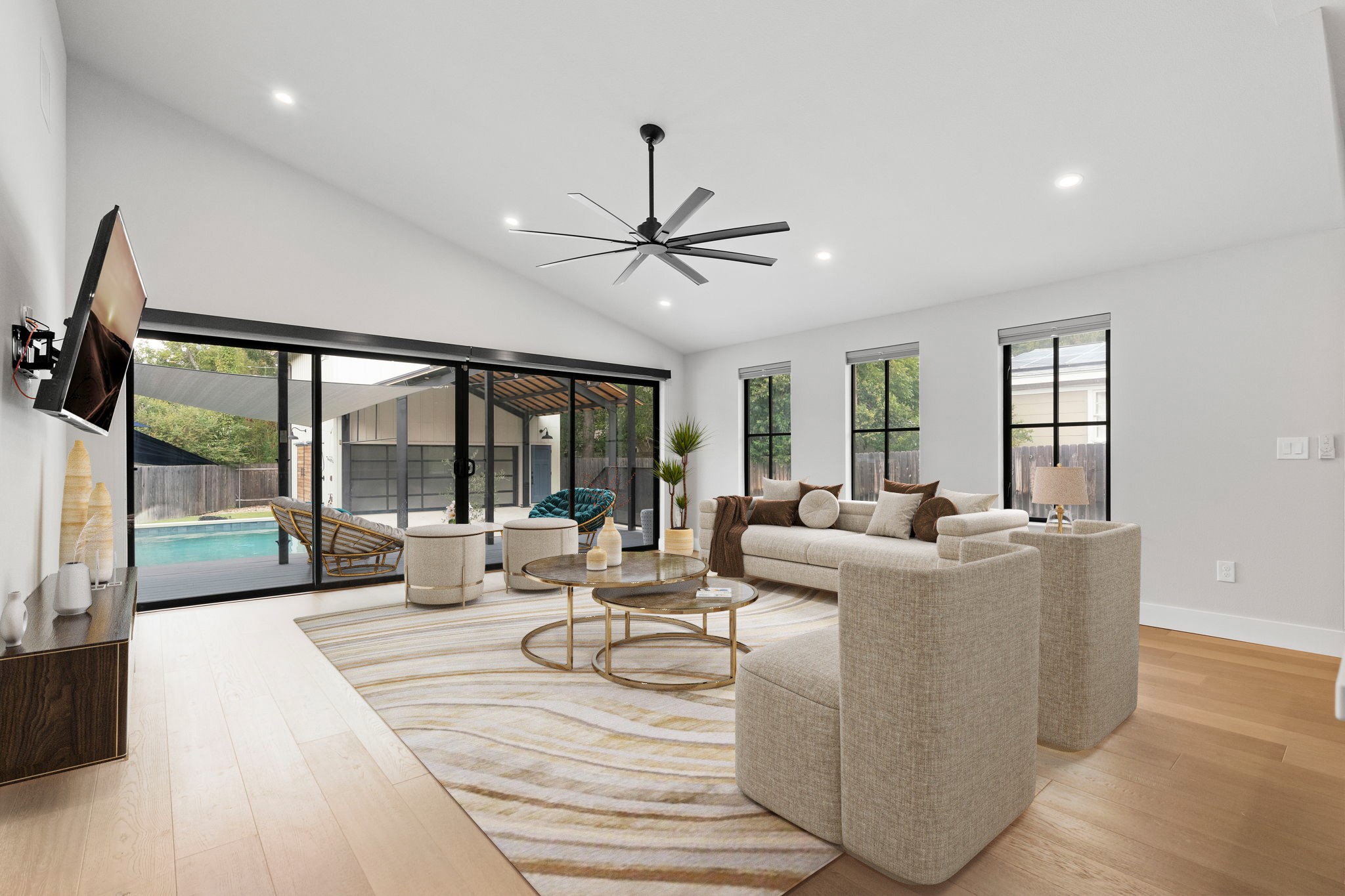 5604 Bull Creek Road Austin, TX 78756 - Photo 14 of 39 Gorgeous glass doors open to the outdoor living area and outdoor kitchen. *This photo has been virtually staged*