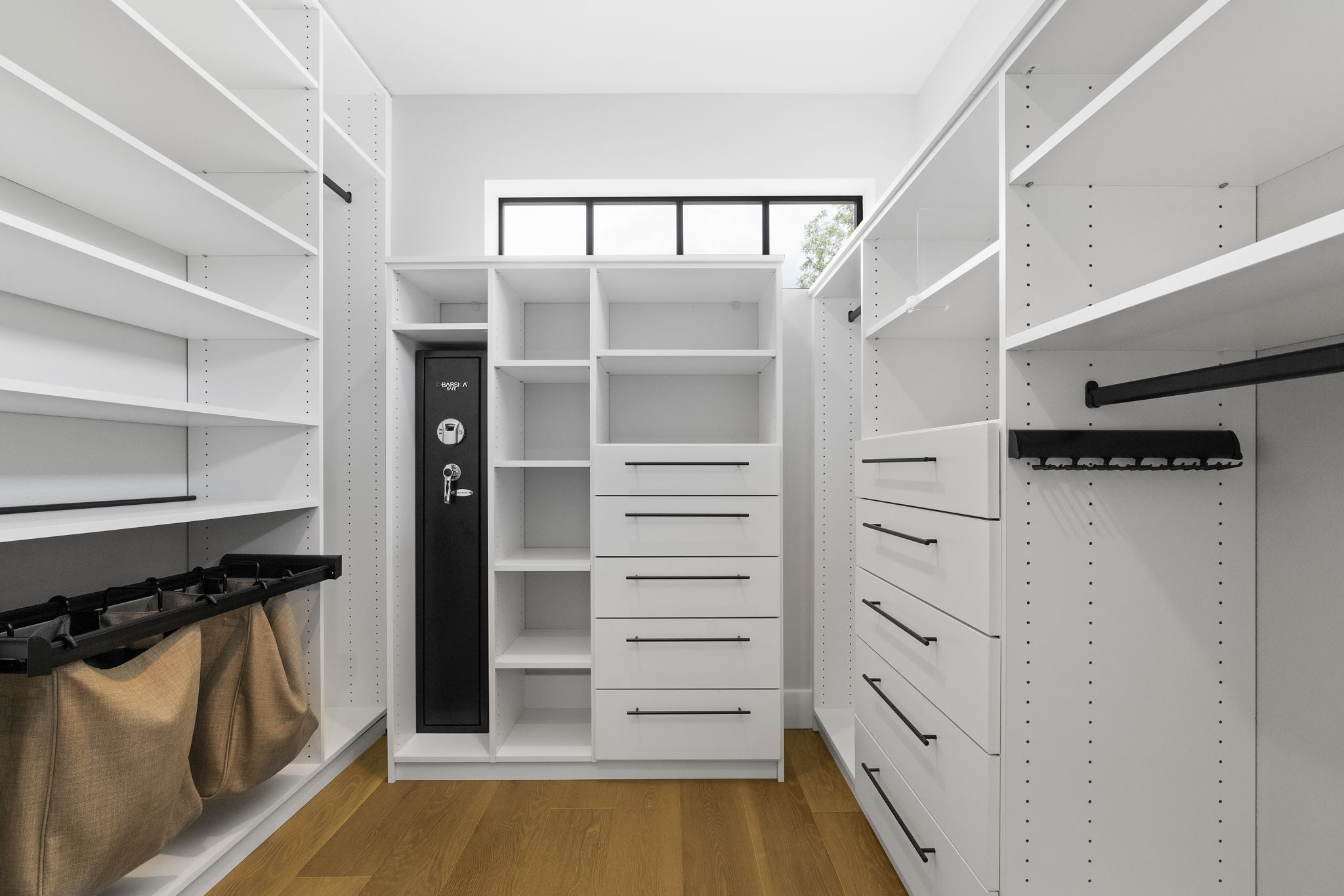 5604 Bull Creek Road Austin, TX 78756 - Photo 22 of 39 Don't miss the large walk-in closet! Complete with drawers and shelving system for convenience.