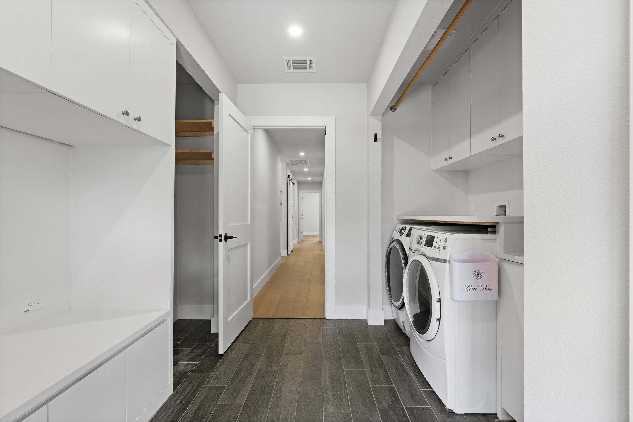 5604 Bull Creek Road Austin, TX 78756 - Photo 23 of 39 Incredibly functional laundry and mud room downstairs provides plenty of storage options, lots of counter space for folding and room for an additional refrigerator.