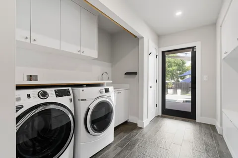 a view of a hallway with washer and dryer