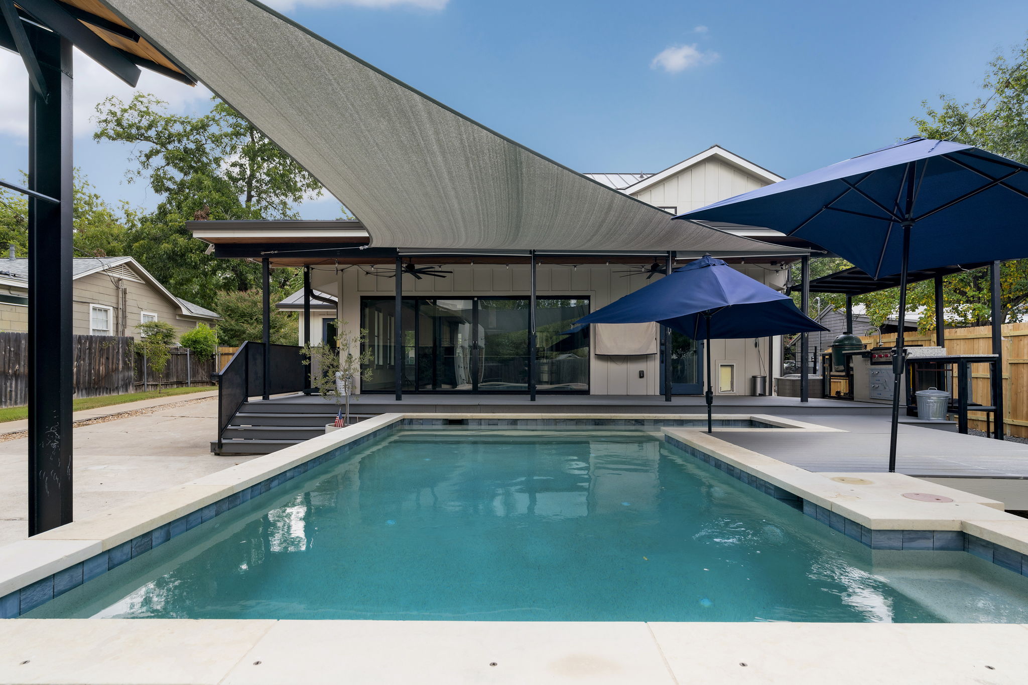 5604 Bull Creek Road Austin, TX 78756 - Photo 31 of 39 Lots of shade options for summertime! The outdoor kitchen offers a sink, grill and aBig Green Egg.