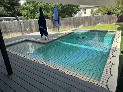 a view of swimming pool with a bench