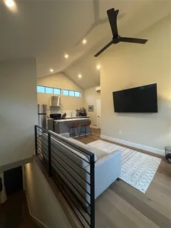 a kitchen with stainless steel appliances kitchen island sink stove and cabinets
