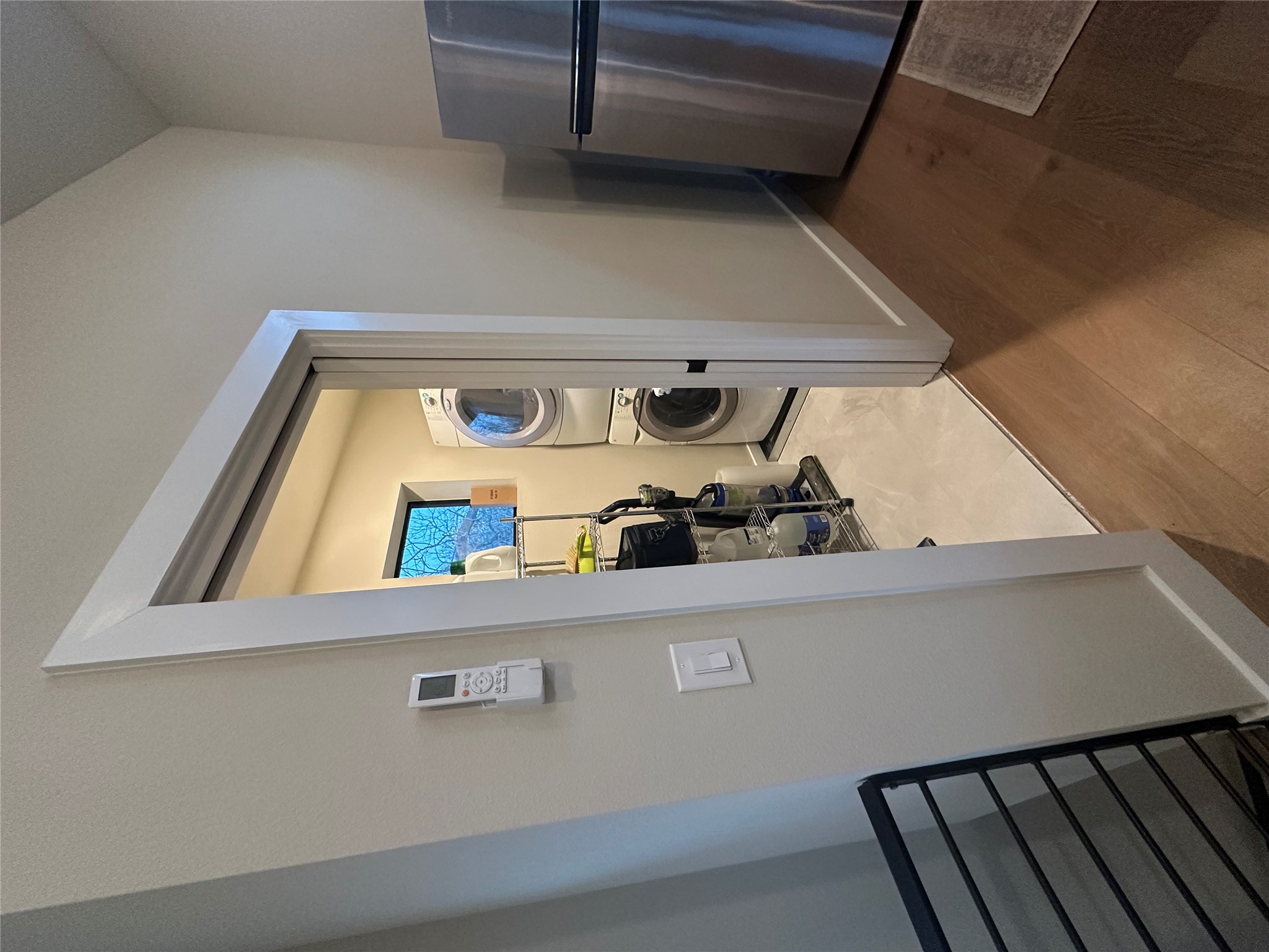 5604 Bull Creek Road Austin, TX 78756 - Photo 35 of 39 Laundry room with stacked washing machine and dryer provided.