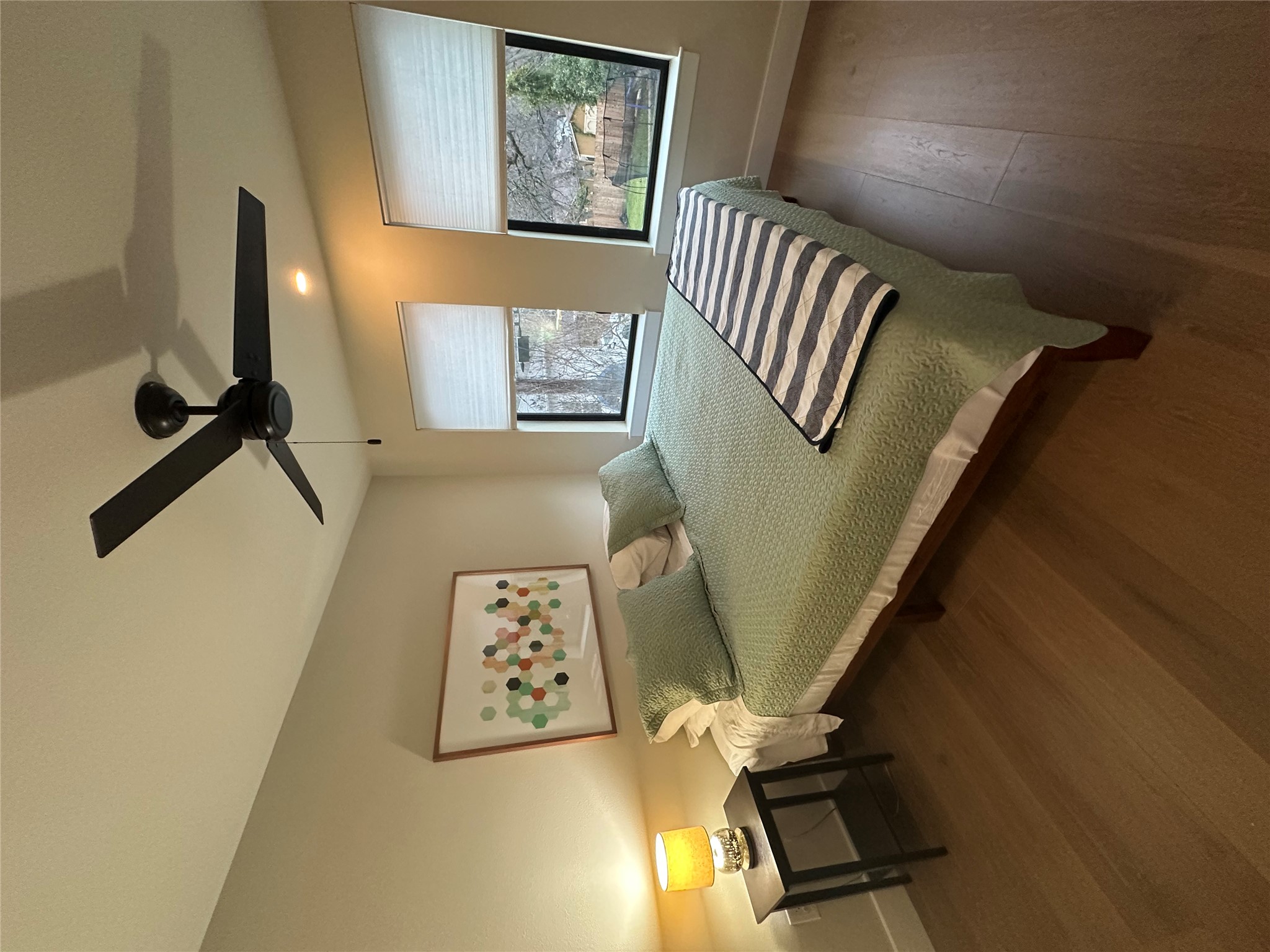 5604 Bull Creek Road Austin, TX 78756 - Photo 37 of 39 Bedroom comes complete with bed, tables and lamp.