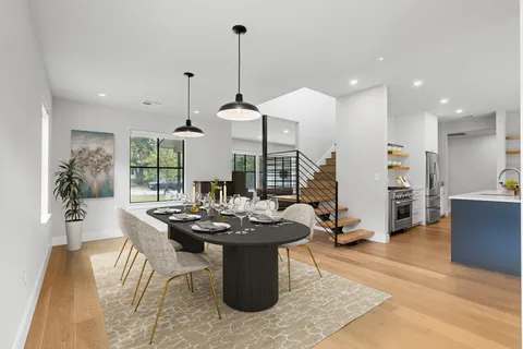 a dining room with furniture and window