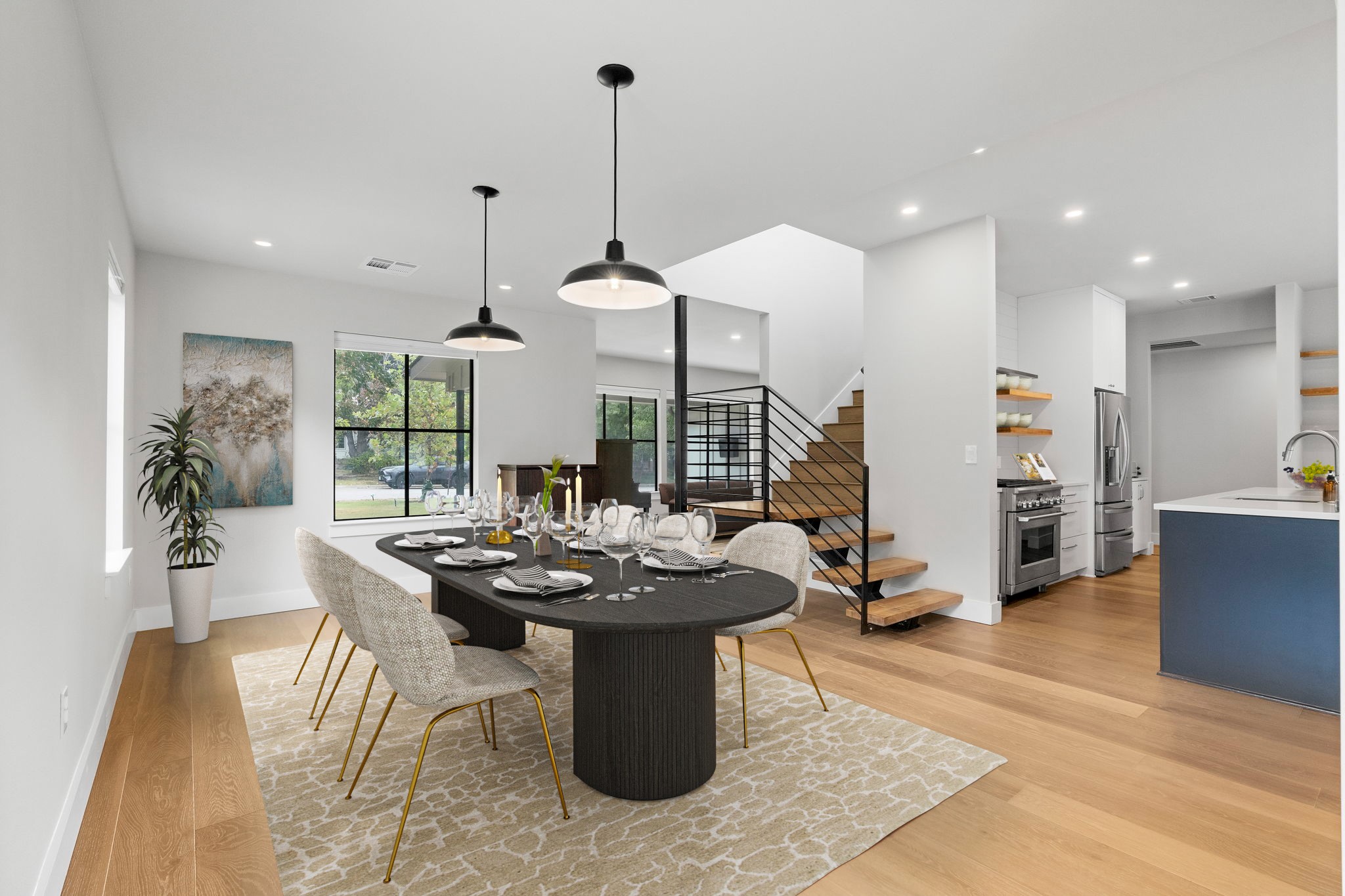 5604 Bull Creek Road Austin, TX 78756 - Photo 4 of 39 The dining area is open to the formal sitting or additional living area in the front of the home. *This photo has been virtually staged*