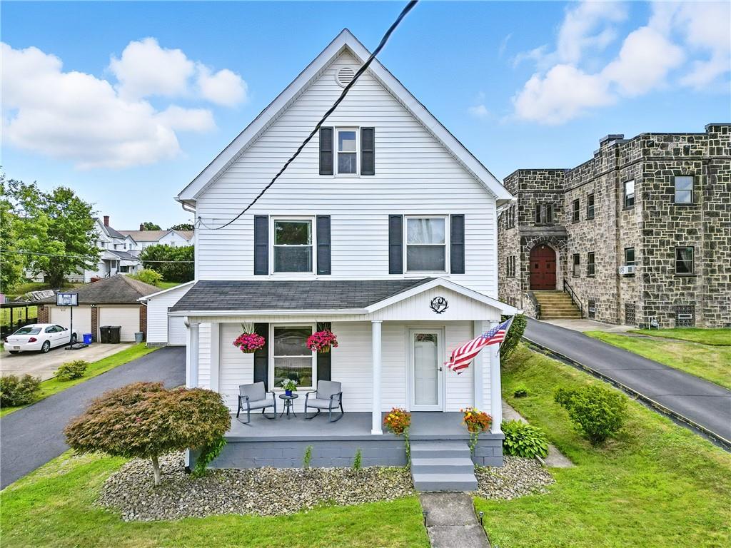519 West Ridge Avenue Sharpsville, PA 16150 - Photo 2 of 48 a front view of a house with garden