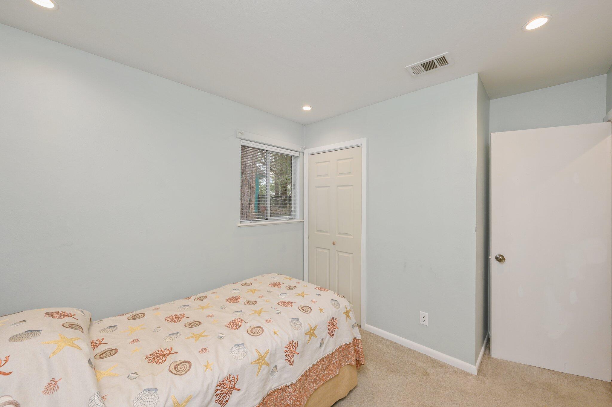 133 Smith Street Crestview, FL 32539 - Photo 18 of 28 a bedroom with a bed and a window