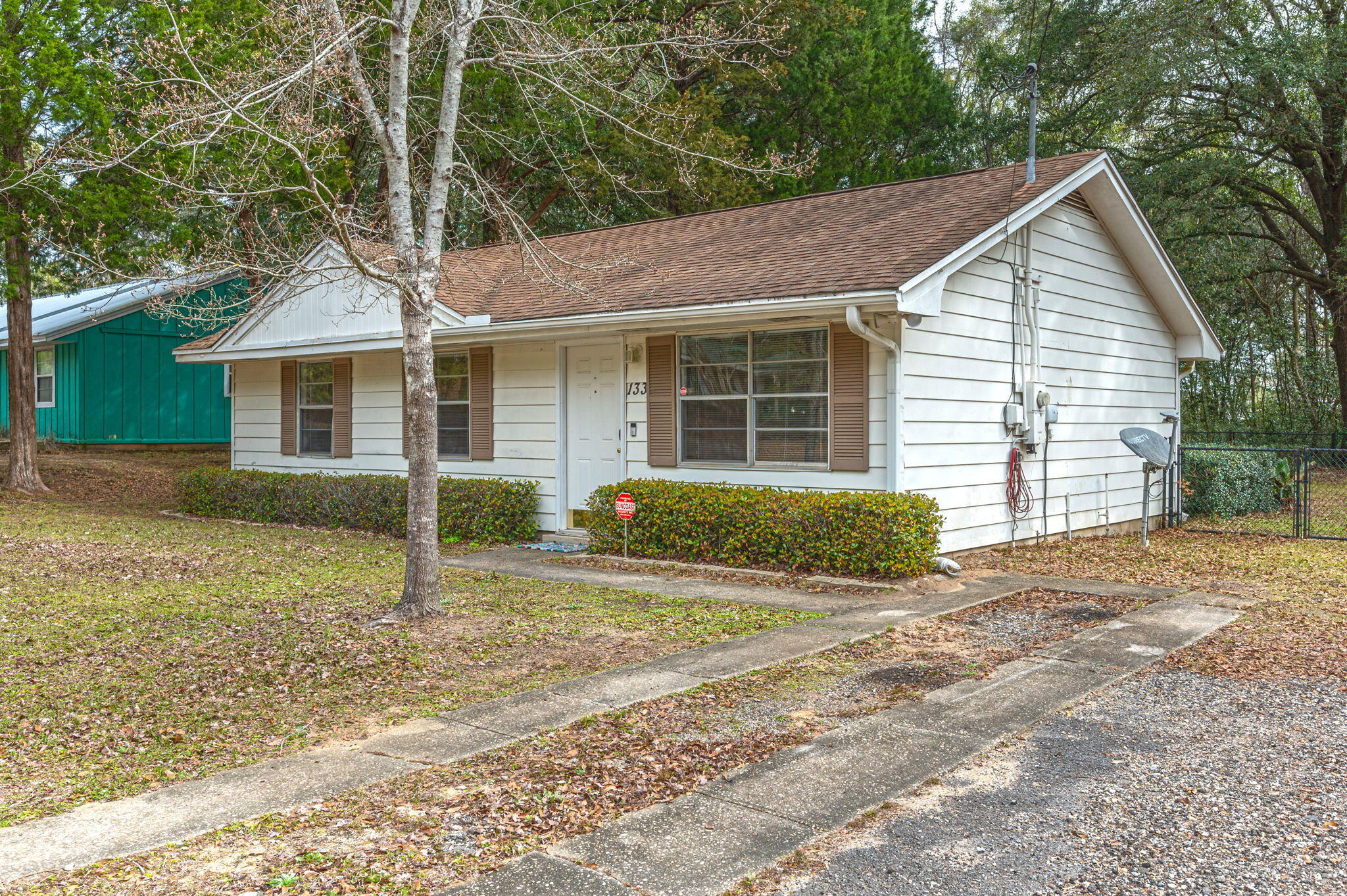 133 Smith Street Crestview, FL 32539 - Photo 2 of 28 a view of a house with a yard and large tree