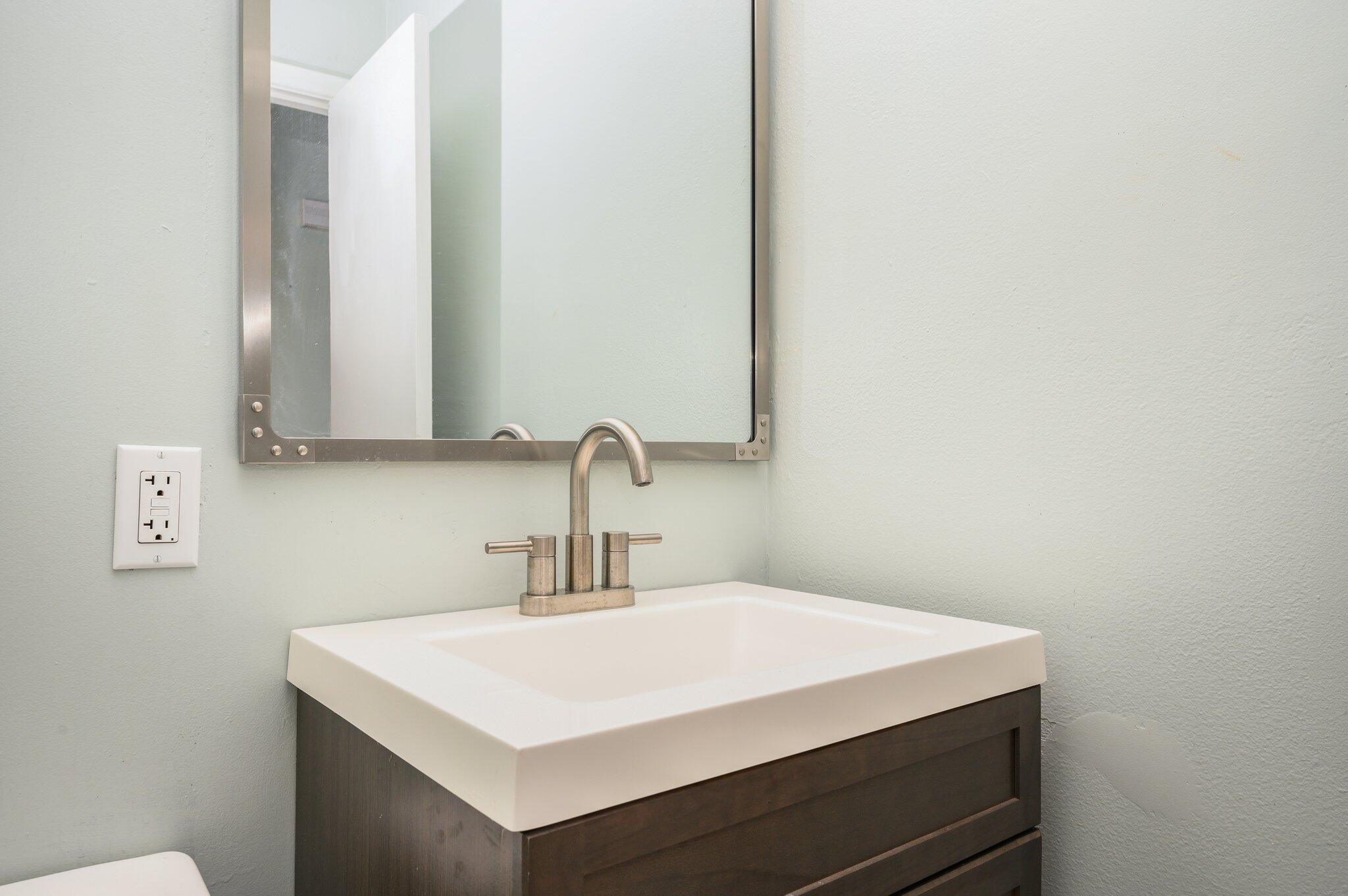 133 Smith Street Crestview, FL 32539 - Photo 21 of 28 a bathroom with a sink and a mirror