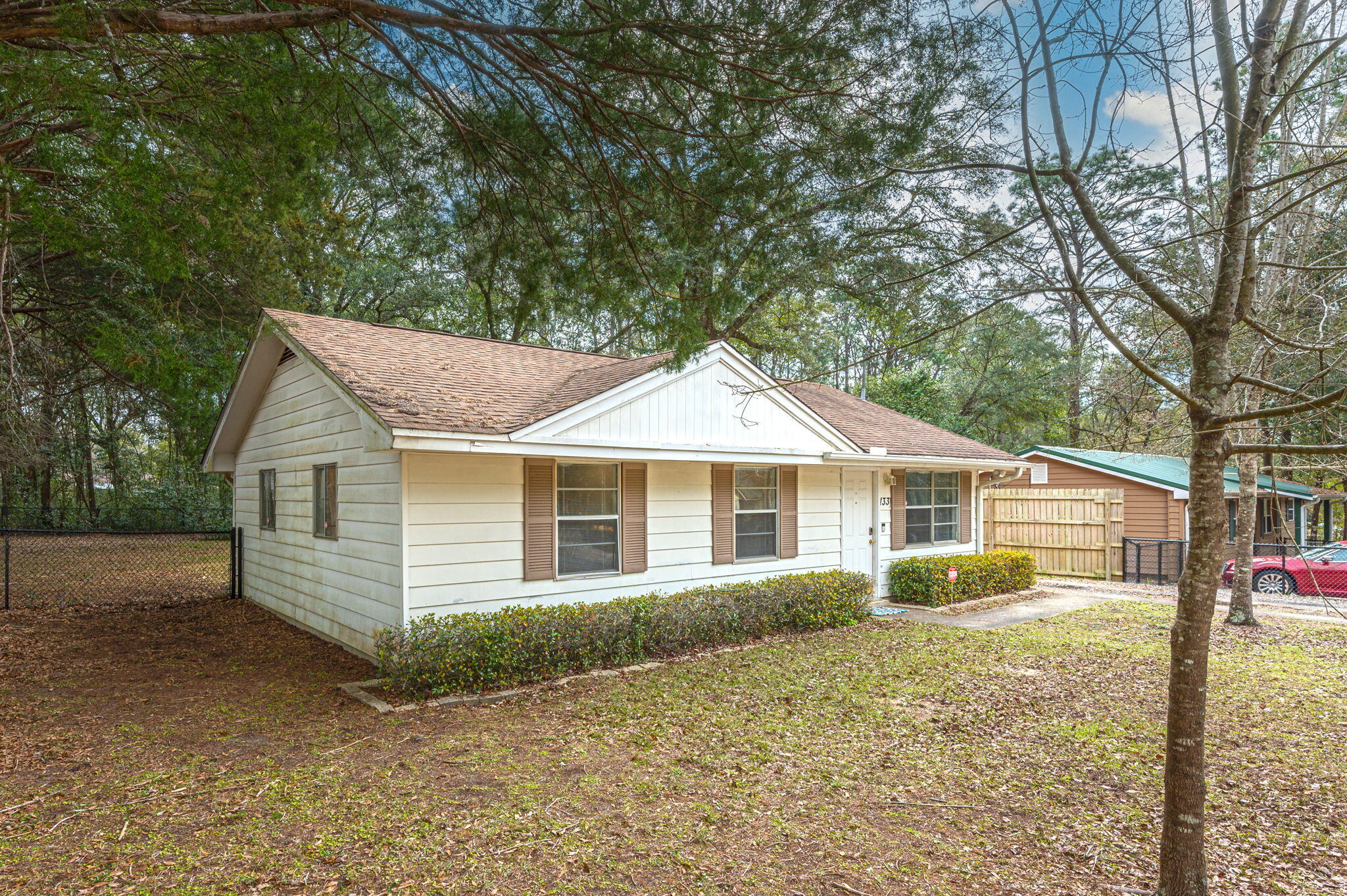 133 Smith Street Crestview, FL 32539 - Photo 3 of 28 a view of a house with a yard