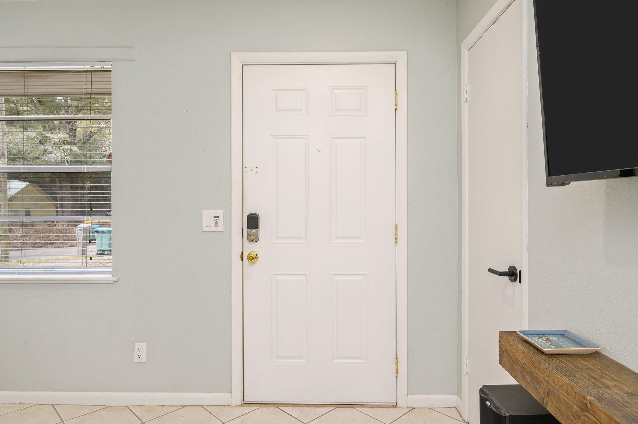 133 Smith Street Crestview, FL 32539 - Photo 4 of 28 an entryway with wooden floor and cabinet
