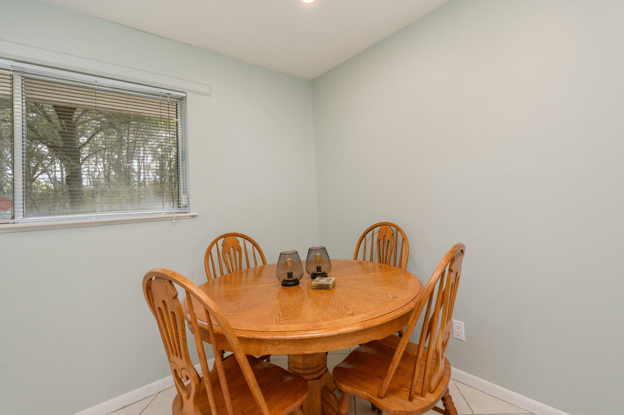 133 Smith Street Crestview, FL 32539 - Photo 9 of 28 a view of a dining room with furniture and window