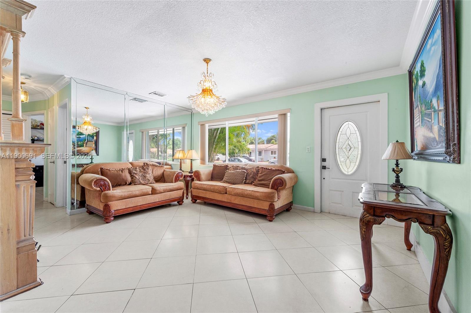 7311 Southwest 139th Avenue Miami, FL 33183 - Photo 12 of 37 a living room with furniture and a large window