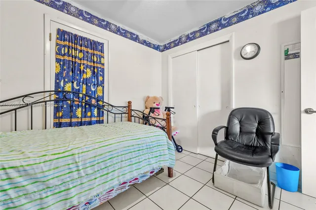 a bedroom with a bed and a table in it