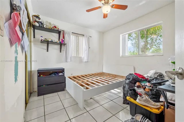 a bedroom with furniture and a chandelier