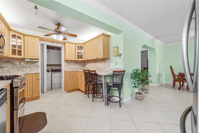 a view of kitchen with furniture and a potted plant