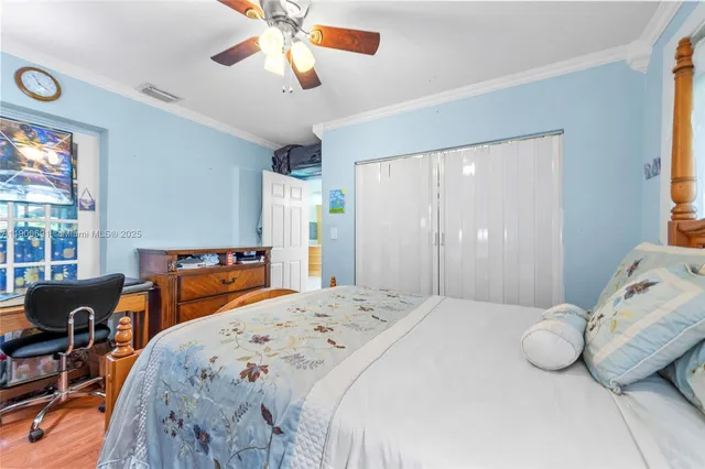 a bedroom with a bed and a table