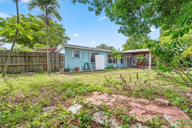 a house view with a garden space
