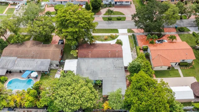 an aerial view of a house with a garden