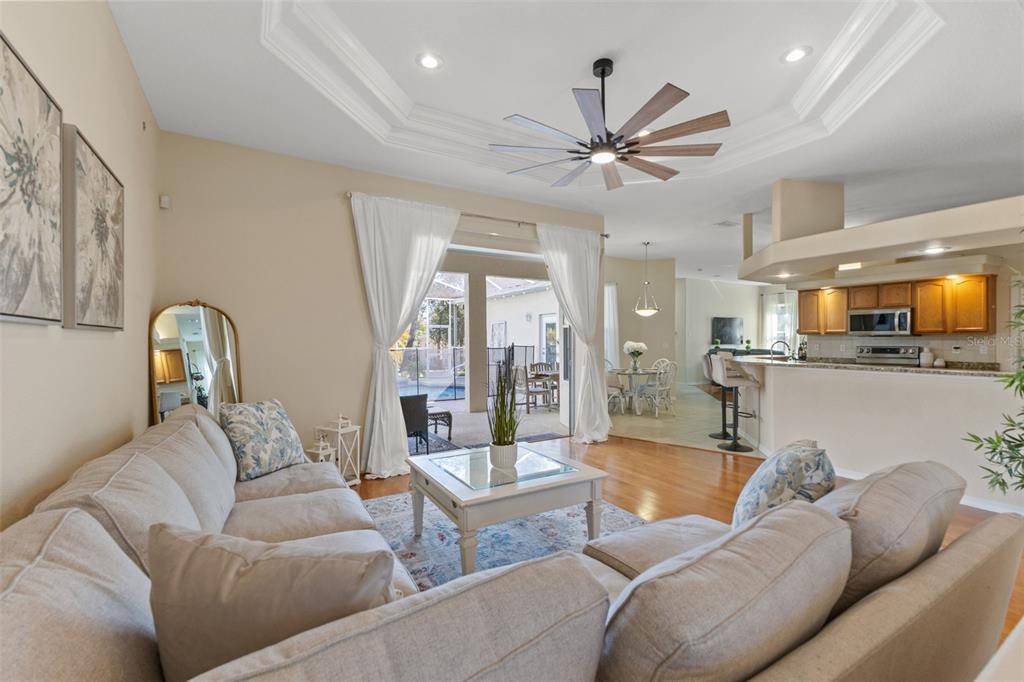 14071 Linden Drive Spring Hill, FL 34609 - Photo 14 of 77 a living room with furniture and a view of kitchen