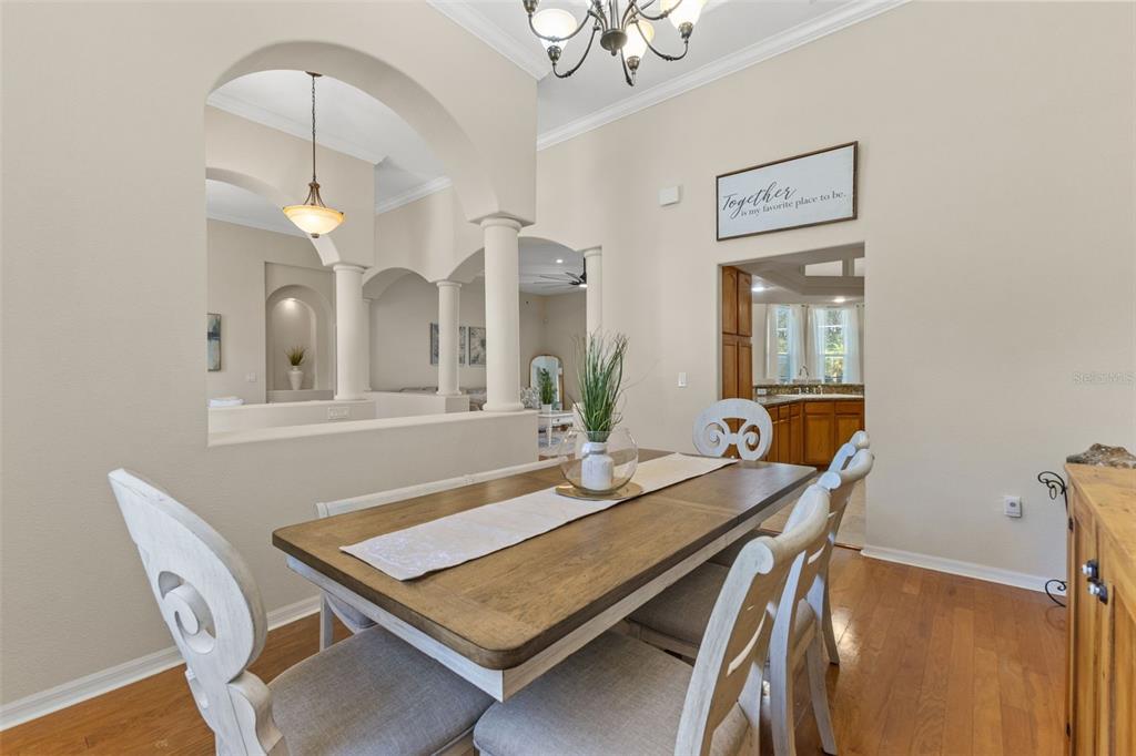 14071 Linden Drive Spring Hill, FL 34609 - Photo 23 of 77 a view of a dining room with furniture and a chandelier