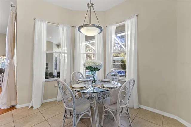 a bedroom with a large bed and a flat tv screen on dresser