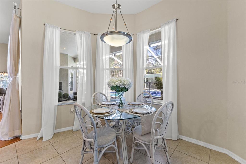 14071 Linden Drive Spring Hill, FL 34609 - Photo 24 of 77 a dining room with furniture and window