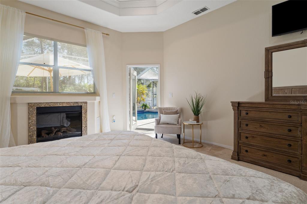 14071 Linden Drive Spring Hill, FL 34609 - Photo 27 of 77 a living room with furniture and a fireplace